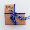 Birthday Gift Box Wrapped with Kraft Paper and Blue Ribbon